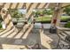 Community grilling area with built-in stainless steel grills and shaded seating, perfect for outdoor entertaining at 2027 Hayes Ln, Holly Springs, NC 27540