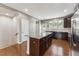 Modern kitchen with granite island and stainless steel appliances at 2027 Hayes Ln, Holly Springs, NC 27540