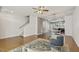 Spacious living room with hardwood floors, open floor plan, and ample natural light at 2027 Hayes Ln, Holly Springs, NC 27540
