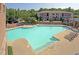 Large community pool surrounded by lounge chairs offers a great place for recreation at 2027 Hayes Ln, Holly Springs, NC 27540