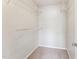 Bright, empty walk-in closet featuring sturdy white wire shelving for organized storage solutions at 2027 Hayes Ln, Holly Springs, NC 27540