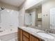A bathroom features a double vanity, bathtub, granite countertops and a shower at 207 Reedhaven Dr, Cary, NC 27513