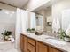 Bathroom featuring double sink vanity and tub with shower at 207 Reedhaven Dr, Cary, NC 27513