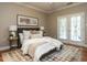 Cozy bedroom with warm colors, wood floors and natural light at 207 Reedhaven Dr, Cary, NC 27513