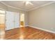 A bedroom features hardwood floors, crown molding, and an ensuite bathroom at 207 Reedhaven Dr, Cary, NC 27513