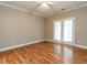 A bedroom features hardwood floors, crown molding and a pair of doors at 207 Reedhaven Dr, Cary, NC 27513