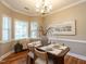 Formal dining room with hardwood floors, natural light and space to gather at 207 Reedhaven Dr, Cary, NC 27513