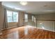 Spacious hallway featuring hardwood floors and natural light at 207 Reedhaven Dr, Cary, NC 27513