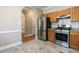 A kitchen features stainless steel appliances, granite countertops and a light tile backsplash at 207 Reedhaven Dr, Cary, NC 27513