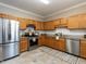Well-equipped kitchen with stainless steel appliances and ample cabinet space at 207 Reedhaven Dr, Cary, NC 27513