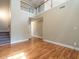 A living room with hardwood floors and staircase at 207 Reedhaven Dr, Cary, NC 27513