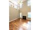 A living room features hardwood floors, a fireplace and natural lighting at 207 Reedhaven Dr, Cary, NC 27513