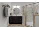 Stylish bathroom with a vanity, towel racks, and a glass-enclosed shower at 212 Allister Dr, Raleigh, NC 27609