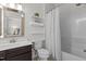 Full bathroom with a vanity, toilet, bathtub, shower and practical storage solutions at 212 Allister Dr, Raleigh, NC 27609