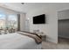 Bedroom with a modern bed, stylish decor, window with natural light, and a sleek TV at 212 Allister Dr, Raleigh, NC 27609