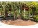 Seating area with flowering pergola offers a peaceful place to sit and relax in the community at 212 Allister Dr, Raleigh, NC 27609