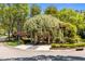 Beautifully landscaped community seating area with a pergola and garden at 212 Allister Dr, Raleigh, NC 27609