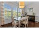 Cozy dining room with natural light, modern furniture, and a warm, inviting atmosphere at 212 Allister Dr, Raleigh, NC 27609