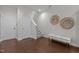 Entryway with hardwood floors, staircase, bench, and decorative wall art at 212 Allister Dr, Raleigh, NC 27609