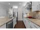 Well-designed kitchen with stainless steel appliances, granite counters, and ample cabinet space at 212 Allister Dr, Raleigh, NC 27609