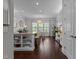 Spacious kitchen with an island, modern appliances, hardwood floors, and bright lighting at 212 Allister Dr, Raleigh, NC 27609