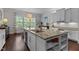 Bright kitchen featuring a large island, modern appliances, and a functional layout at 212 Allister Dr, Raleigh, NC 27609