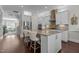 Elegant kitchen with white cabinets, stainless steel appliances, and an open floor plan at 212 Allister Dr, Raleigh, NC 27609