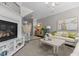 Bright living room features a fireplace, neutral colors, modern furniture, and plenty of natural light at 212 Allister Dr, Raleigh, NC 27609