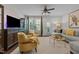 Comfortable living room with hardwood floors, stylish seating, and a ceiling fan at 212 Allister Dr, Raleigh, NC 27609