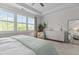 Bright main bedroom with a large dresser, big windows, and a ceiling fan at 212 Allister Dr, Raleigh, NC 27609