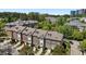 Aerial view of brick townhomes showcasing their well-manicured lawns and attached garages at 212 Allister Dr, Raleigh, NC 27609