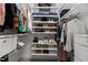 Organized walk-in closet featuring ample shelving and rods for clothes, shoes, and accessories at 212 Allister Dr, Raleigh, NC 27609