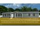 Charming single-story home featuring a classic design, well-maintained yard, and a welcoming entrance at 212 Ellington Path, Henderson, NC 27537
