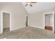 Spacious bedroom with high ceiling, ceiling fan, walk in closet and ensuite bathroom at 215 Oxfordshire Dr, Fuquay Varina, NC 27526