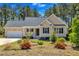 Charming single-story home with a well-manicured lawn and attached garage and welcoming front porch at 215 Oxfordshire Dr, Fuquay Varina, NC 27526