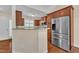 Open kitchen with stainless steel appliances and a breakfast bar at 215 Oxfordshire Dr, Fuquay Varina, NC 27526