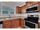 Modern kitchen showcasing stainless steel appliances, ample cabinetry, and a tile backsplash at 215 Oxfordshire Dr, Fuquay Varina, NC 27526