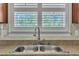 Modern kitchen with double sink, and window for natural lighting at 215 Oxfordshire Dr, Fuquay Varina, NC 27526