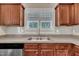 Kitchen sink with stainless steel faucet and backsplash at 215 Oxfordshire Dr, Fuquay Varina, NC 27526