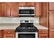 This modern kitchen features stainless steel appliances and plenty of counter space at 215 Oxfordshire Dr, Fuquay Varina, NC 27526