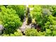 Overhead view of a home enveloped by lush greenery, showcasing its secluded and private setting at 2307 Piedmont Dr, Sanford, NC 27330