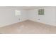 An open basement space with tile floors and bright neutral paint at 2307 Piedmont Dr, Sanford, NC 27330