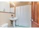 Standard bathroom with a pedestal sink, basic shower, and a traditional vanity mirror at 2307 Piedmont Dr, Sanford, NC 27330