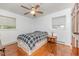 This bedroom features natural light from two windows and a classic ceiling fan at 2307 Piedmont Dr, Sanford, NC 27330