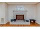 Close-up of a brick fireplace with decorative accents in a classic living room at 2307 Piedmont Dr, Sanford, NC 27330