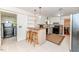 Charming kitchen features an eat-in bar area, white cabinets, and black appliances at 2307 Piedmont Dr, Sanford, NC 27330