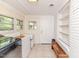 Functional laundry area with modern washer, dryer, freezer and built in shelves at 2307 Piedmont Dr, Sanford, NC 27330