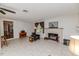 Cozy living room with fireplace, neutral walls, and tile flooring at 2307 Piedmont Dr, Sanford, NC 27330