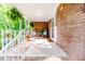 Inviting covered porch with decorative hanging plants and a cozy seating area at 2307 Piedmont Dr, Sanford, NC 27330