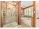 Spa-like bathroom with glass shower, soaking tub, and large window for natural light and comfort at 2545 Churchill Dr, Burlington, NC 27215